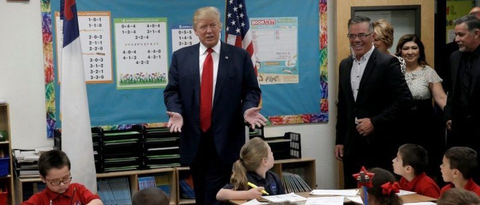 Republican presidential nominee Donald Trump visits children in a classroom during a campaign visit to the International Church of Las Vegas and the International Christian Academy in Las Vegas