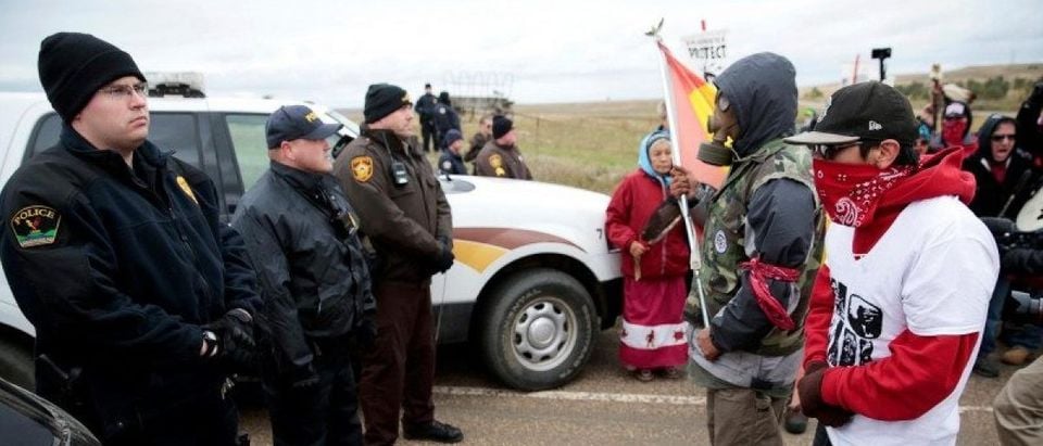 Dakota Access Pipeline protesters square off against police between the Standing Rock Reservation and the pipeline route outside the little town of Saint Anthony, North Dakota, U.S., October 5, 2016. REUTERS/Terray Sylvester/File Photo