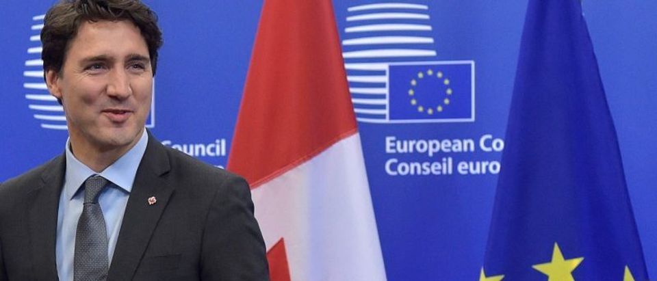 Canada's PM Trudeau looks on before signing the CETA at the European Council in Brussels