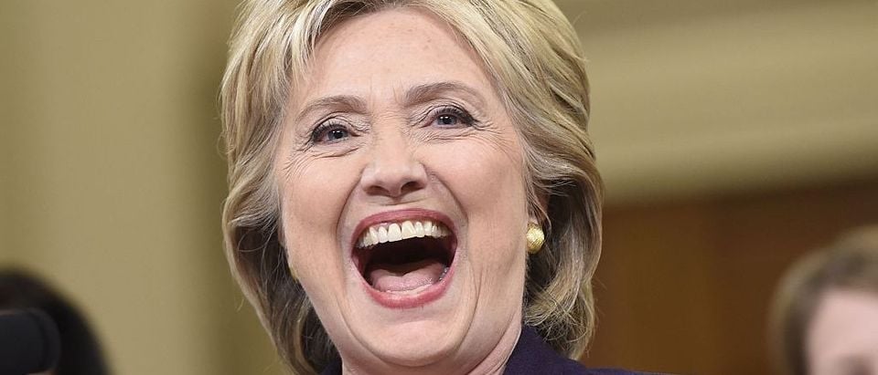 Former Secretary of State and Democratic Presidential hopeful Hillary Clinton laughs during testimony before the House Select Committee on Benghazi on Capitol Hill in Washington, DC, October 22, 2015. Clinton took the stand Thursday to defend her role in responding to deadly attacks on the US mission in Libya, as Republicans forged ahead with an inquiry criticized as partisan anti-Clinton propaganda. AFP PHOTO / SAUL LOEB / AFP / SAUL LOEB (Photo credit should read SAUL LOEB/AFP/Getty Images)