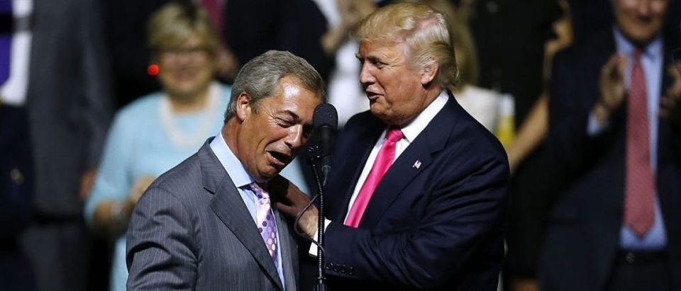 Republican Presidential nominee Donald Trump, right, greets United Kingdom Independence Party leader Nigel Farage during a campaign rally at the Mississippi Coliseum on August 24, 2016 in Jackson, Mississippi