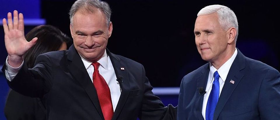 Democratic vice presidential candidate Tim Kaine (L) and Republican vice presidential candidate Mike Pence (R) arrive on stage for the US vice presidential debate at Longwood University in Farmville, Virginia on October 4, 2016