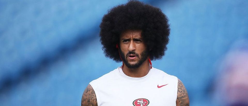 Colin Kaepernick warms up for his first NFL start of the season. (Photo credit: Getty Images)