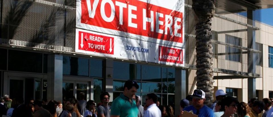People line up to vote early outside the San Diego County Elections Office in San Diego, California