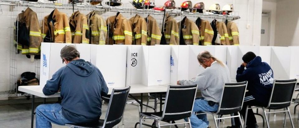 Voters fill out their ballots on election day for the U.S. presidential election at Elevation Fire Station in Benson