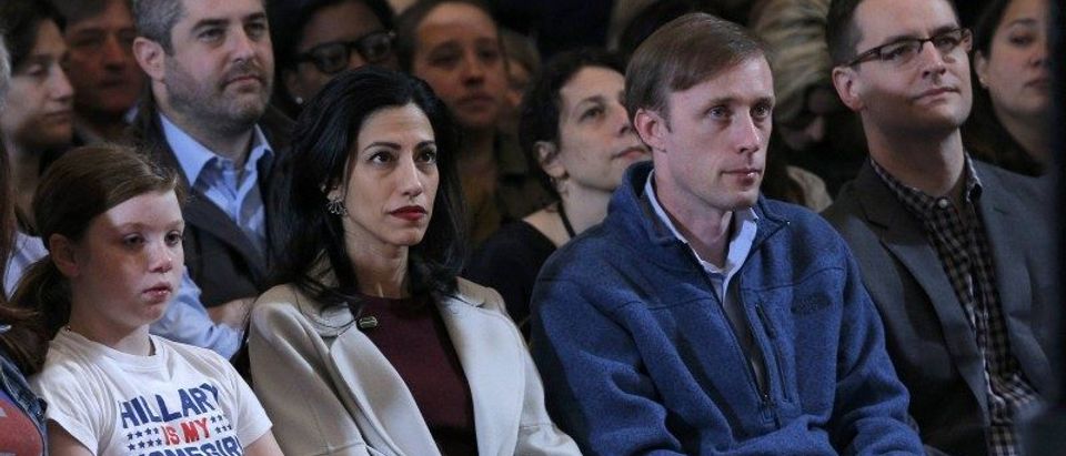 Abedin and Mook listen as Hillary Clinton addresses her staff and supporters about the results of the U.S. election at a hotel in New York