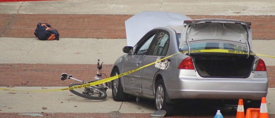A car which police say was used by an attacker to plow into a group of students is seen outside Watts Hall on Ohio State University's campus in Columbus