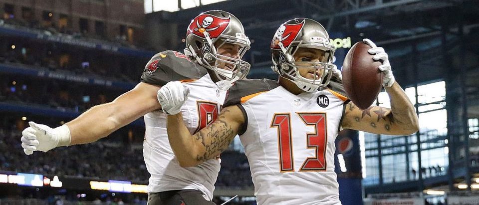 Mike Evans #13 celebrates his fourth quarter touchdown with Luke Stocker #88 of the Tampa Bay Buccaneers while playing the Detroit Lions at Ford Field on December 7, 2014 in Detroit. (Photo by Leon Halip/Getty Images)