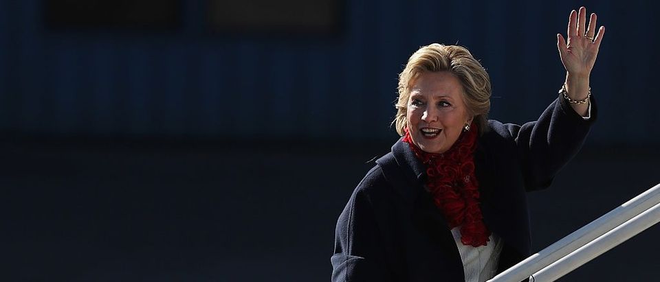 Hillary Clinton waves as she boards her campaign plane at Westchester County Airport on November 1, 2016 (Getty Images)