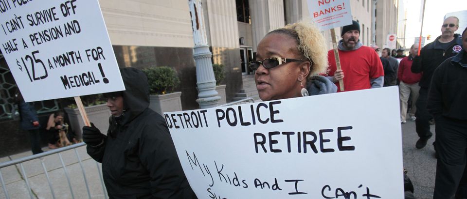 Detroit city workers and retirees protest against the city's municipal bankruptcy filing, outside the Federal courthouse in Detroit