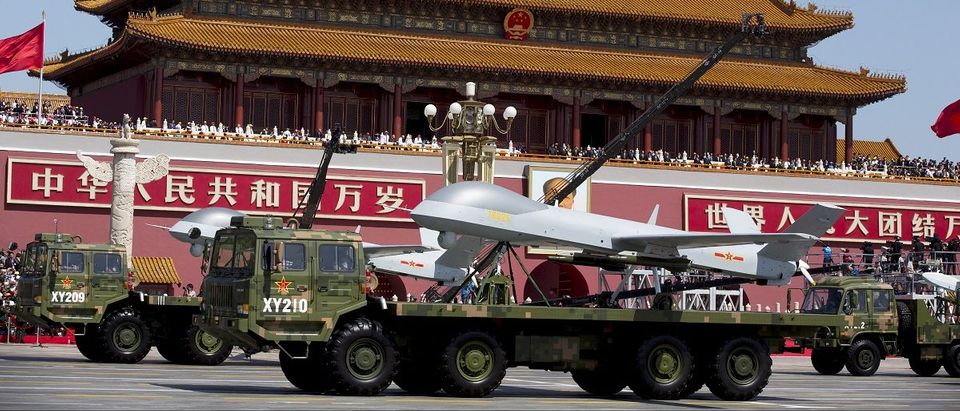 Military vehicles carrying Wing Loong, a Chinese-made medium altitude long endurance unmanned aerial vehicle, travel past Tiananmen Gate during a military parade to commemorate the 70th anniversary of the end of World War II in Beijing