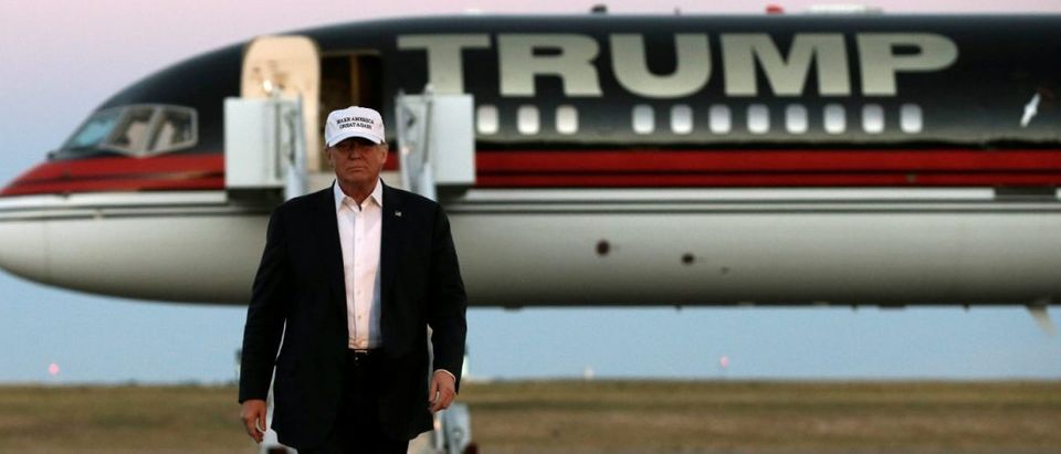 Republican presidential nominee Donald Trump walks off his plane at a campaign rally in Colorado Springs, Colorado. REUTERS/Mike Segar