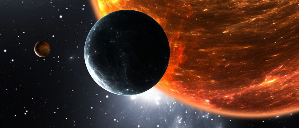 Extrasolar planets or exoplanets and red dwarf or red supergiant. 3D illustration (Shutterstock/Jurik Peter)