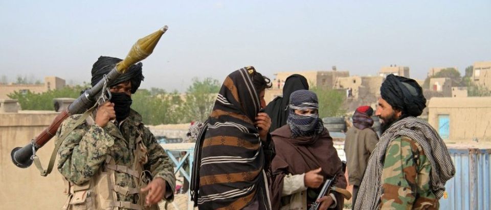 File picture of members of the Taliban at the site of the execution of three men accused of murdering a couple during a robbery in Ghazni Province