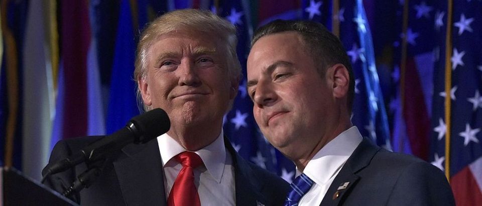Reince Priebus hugs Donald Trump during an election night event at the New York Hilton Midtown (Getty Images)