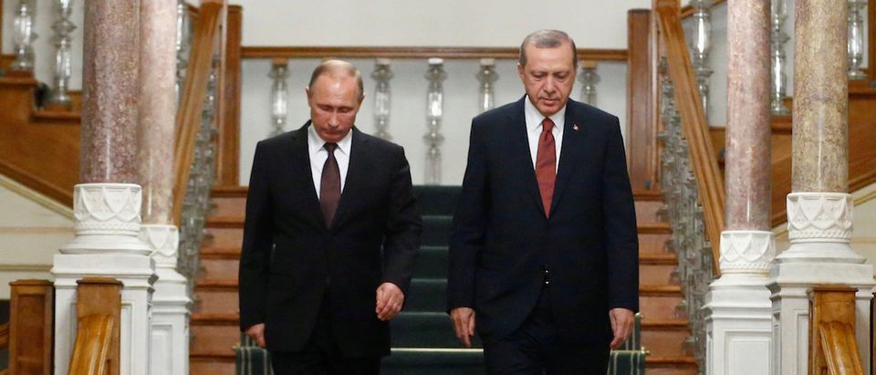 Russian President Putin and his Turkish counterpart Erdogan arrive for a news conference following their meeting in Istanbul