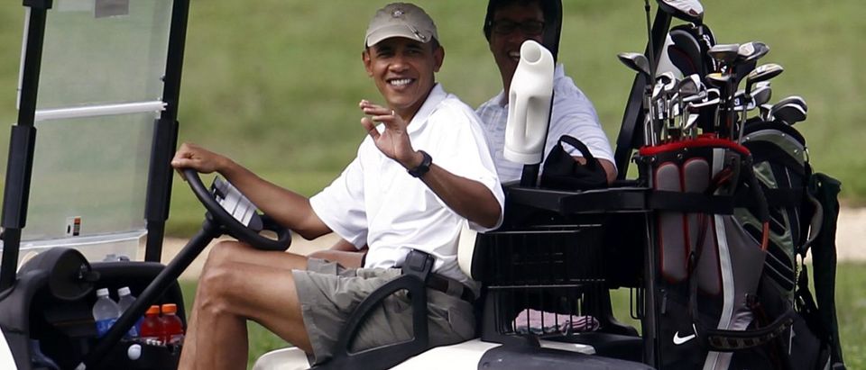 U.S. President Barack Obama waves from a golf cart at the Mid-Pacific Country Club in Kailua, Hawaii, December 28, 2010. With Obama is his friend Mike Ramos. REUTERS/Kevin Lamarque