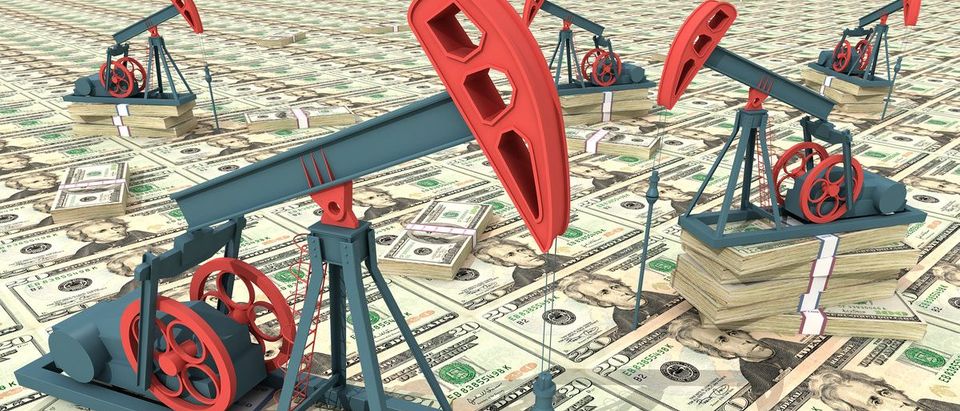 Oil pumps on dollar banknotes. Oil rig cash money Conceptual 3D illustration. (Shutterstock/AKOBCHUK VASYL)