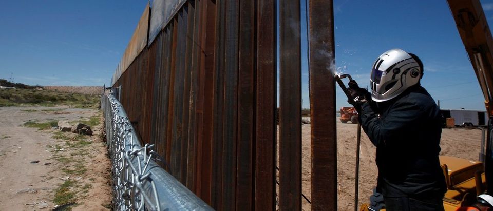 A U.S. worker builds a section of the U.S.-Mexico border wall at Sunland Park, U.S. opposite the Mexican border city of Ciudad Juarez