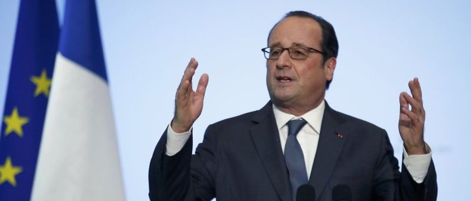 French President Francois Hollande delivers a speech during a visit at a forum entitled "La France s'engage" in Paris