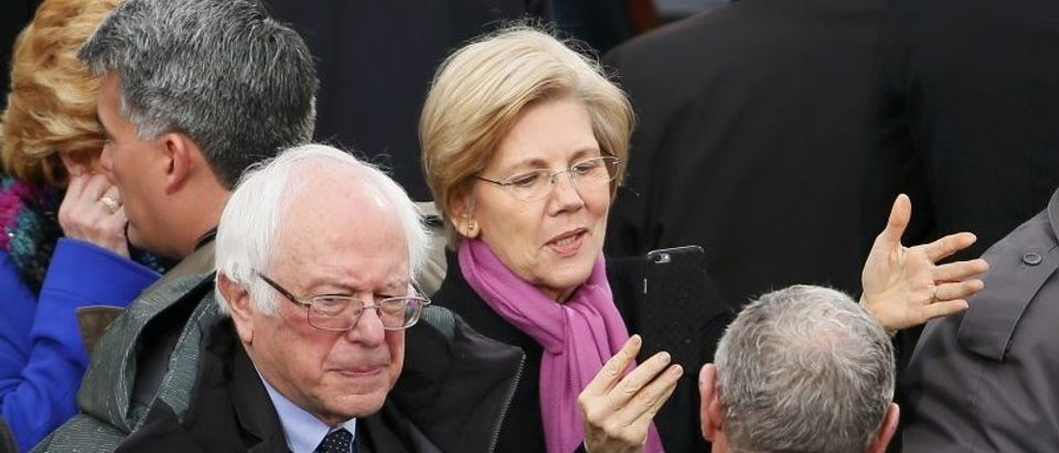Democratic Senators Bernie Sanders and Elizabeth Warren speak at the inauguration ceremonies in Washington