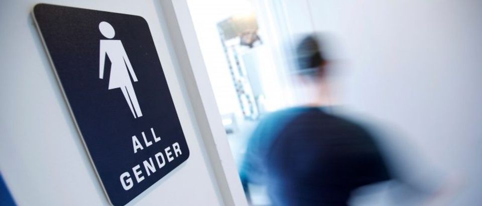 File Photo: A bathroom sign welcomes both genders at the Cacao Cinnamon coffee shop in Durham North Carolina