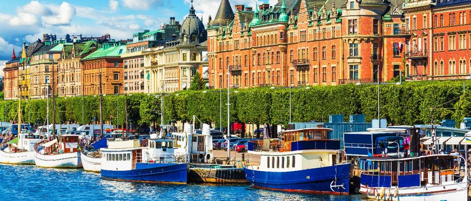 Scenic summer panorama of the Old Town (Gamla Stan) pier architecture in Stockholm, Sweden: Scanrail1/shutterstock