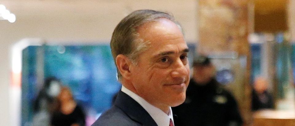 David Shulkin, Under Secretary of Health for the U.S. Department of Veterans Affairs, waves to a reporter after meeting in the lobby of Trump Tower in Manhattan, New York