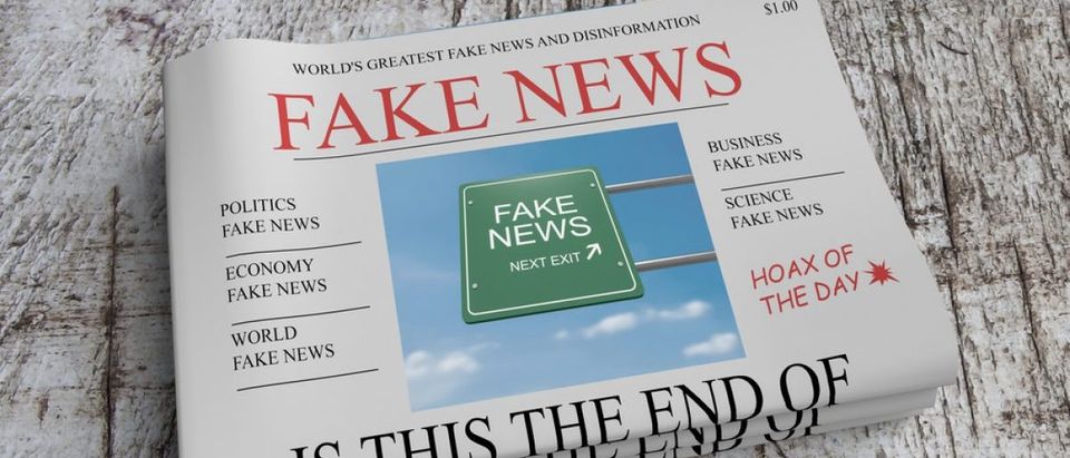 Pile of newspapers with fake news. (Credit: cbies/Shutterstock)
