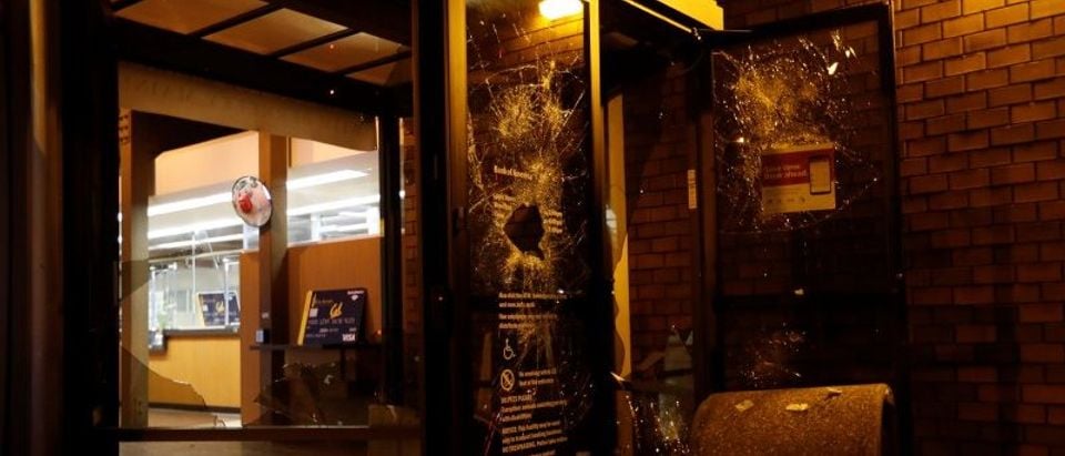 A vandalized Bank of America office is seen after a student protest turned violent at UC Berkeley during a demonstration over right-wing speaker Milo Yiannopoulos, who was forced to cancel his talk, in Berkeley, California