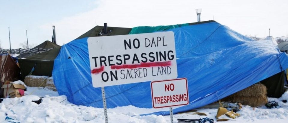 A modified "No Trespassing" sign is seen in the opposition camp against the Dakota Access oil pipeline (DAPL) near Cannon Ball, North Dakota, U.S., February 8, 2017. REUTERS/Terray Sylvester