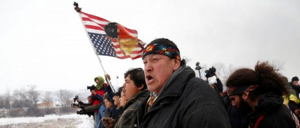 Raymond Kingfisher, 59, of the Northern Cheyenne Tribe, sings during a march on the outskirts of the main opposition camp against the Dakota Access oil pipeline near Cannon Ball, North Dakota, U.S., February 22, 2017. REUTERS/Terray Sylvester
