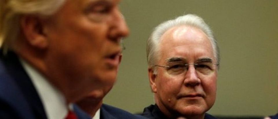 Health and Human Services Secretary Tom Price (C) and Aetna CEO Mark Bertolini (R) listen to U.S. President Donald Trump speak during a meeting with health insurance company CEOs at the White House in Washington, U.S. February 27, 2017. REUTERS/Kevin Lamarque