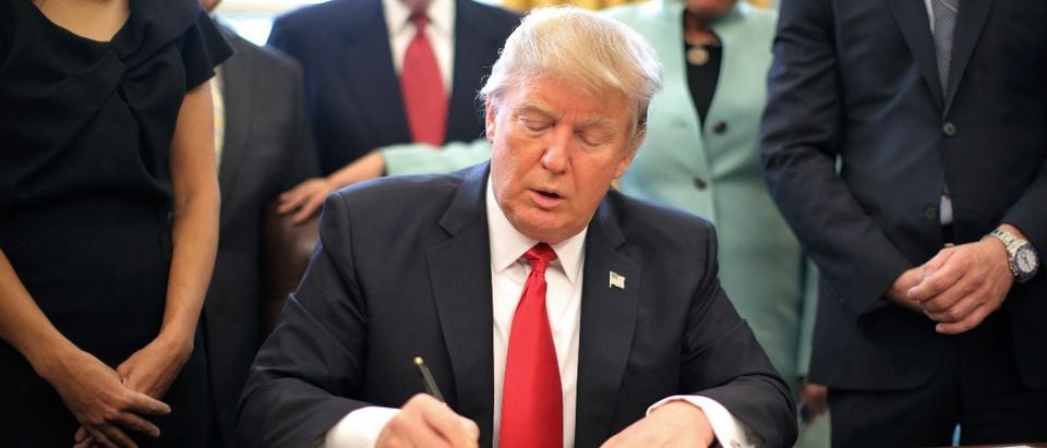 U.S. President Donald Trump signs an executive order