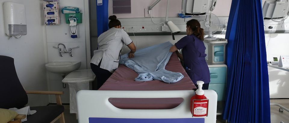 Nurses prepare a bed on a ward at St Thomas' Hospital in central London