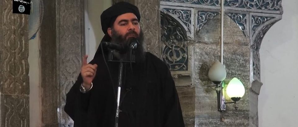 This July 5, 2014 photo shows an image grab taken from a propaganda video released by al-Furqan Media allegedly showing the leader of the Islamic State (IS) jihadist group, Abu Bakr al-Baghdadi, aka Caliph Ibrahim, adressing Muslim worshippers at a mosque in the militant-held northern Iraqi city of Mosul. Baghdadi, who on June 29 proclaimed a "caliphate" straddling Syria and Iraq, purportedly ordered all Muslims to obey him in the video released on social media. In early 2014 the self-styled Islamic State entered the northern Syrian city of Raqqa, declaring it their capital and beginning a reign of terror marked by grisly public executions. Armed sharia police patrolled the streets as "enemies" of the regime were crucified or decapitated, their severed heads impaled on spikes in the city square. Student Abdalaziz Alhamza and his friends decided to form "Raqqa is Being Silently Slaughtered" (RBSS), a band of courageous citizen journalists who risk their lives to document IS atrocities. AFP/Getty Images.