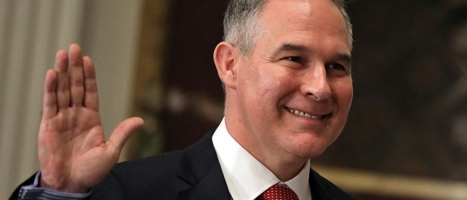 Director of Environmental Protection Agency Scott Pruitt is sworn in by Justice Samuel Alito (not pictured) at the Executive Office in Washington