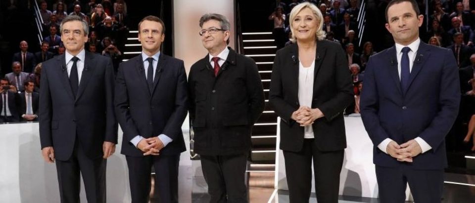 French presidential election candidates Francois Fillon, Emmanuel Macron, Jean-Luc Melenchon, Marine Le Pen and Benoit Hamon, pose before a debate organised by French private TV channel TF1 in Aubervilliers
