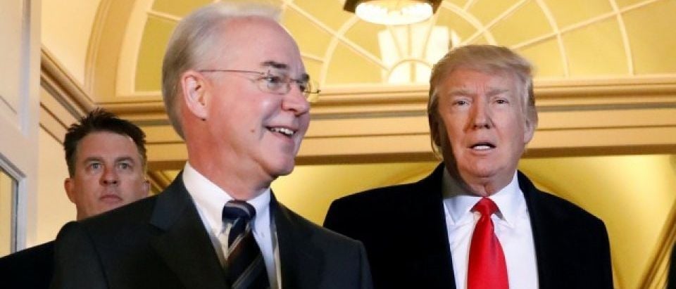 U.S. President Donald Trump (C) and Health and Human Services Secretary Tom Price (L) enter the U.S. Capitol in Washington, U.S., March 21, 2017. REUTERS/Kevin Lamarque