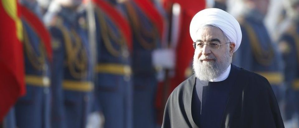 Iranian President Rouhani inspects honour guard during welcoming ceremony upon his arrival at Vnukovo International Airport in Moscow