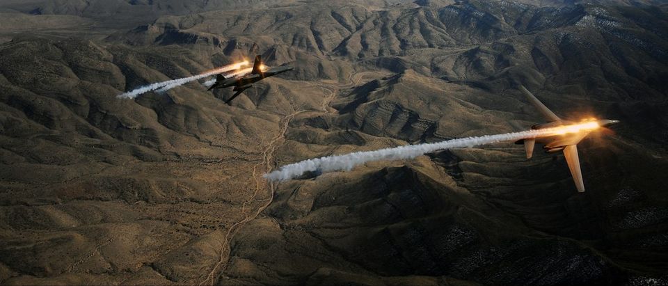 A two-ship of B-1B Lancers assigned to the 28th Bomb Squadron, Dyess Air Force Base, Texas, release chaff and flares while maneuvering over New Mexico during a training mission Feb. 24, 2010. Dyess celebrates the 25th anniversary of the first B-1B bomber arriving at the base. (U.S. Air Force photo/ Master Sgt. Kevin J. Gruenwald)