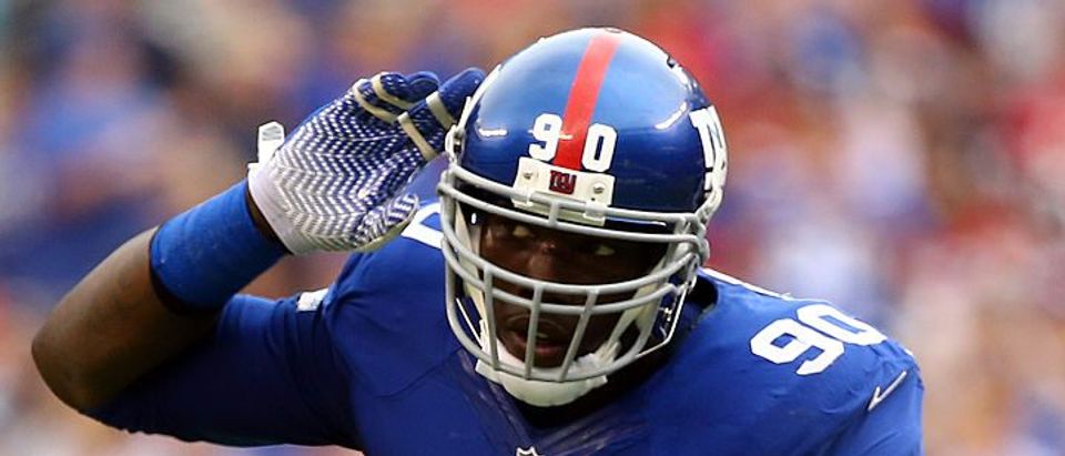 Jason Pierre-Paul #90 of the New York Giants reacts against the Houston Texans at MetLife Stadium on September 21, 2014 in East Rutherford, New Jersey. (Photo by Al Bello/Getty Images)