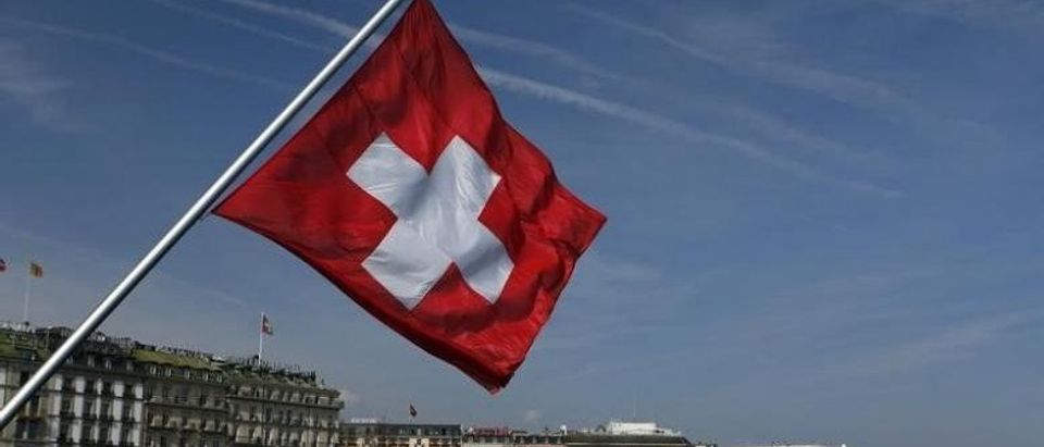 A Swiss flag is pictured on the Mont-Blanc bridge over Lake Leman in Geneva
