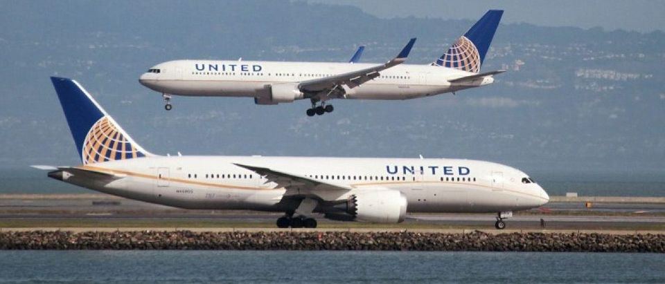 A United Airlines Boeing 787 taxis as a United Airlines Boeing 767 lands at San Francisco International Airport, San Francisco, California, U.S. on February 7, 2015. REUTERS/Louis Nastro