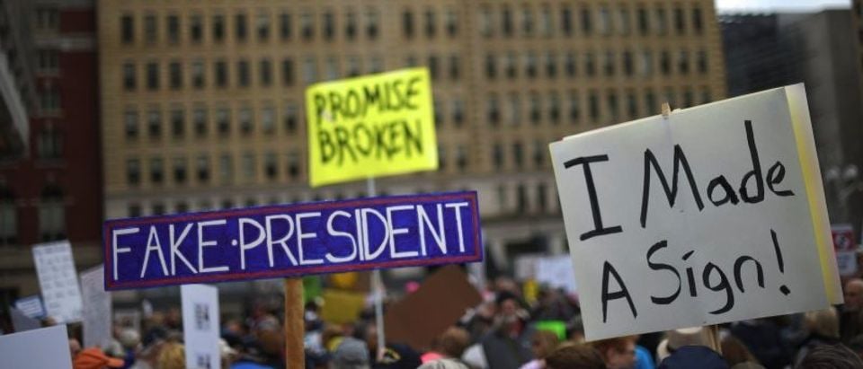 Demonstrators protest in response to President Donald Trump's refusal to make his tax returns public in Philadelphia, Pennsylvania