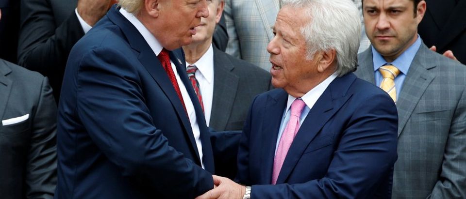 U.S. President Donald Trump shakes hands with CEO of the New England Patriots Robert Kraft during an event honoring the Super Bowl champion New England Patriots at the White House in Washington, U.S., April 19, 2017. REUTERS/Joshua Roberts