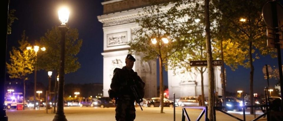 An armed soldier secures a side road near the Champs Elysees Avenue after a shooting incident in Paris, France, April 20, 2017. REUTERS/Benoit Tessier