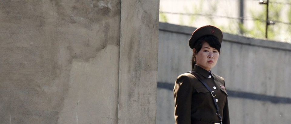 A North Korean soldier stands guard on the banks of Yalu River, near Sinuiju