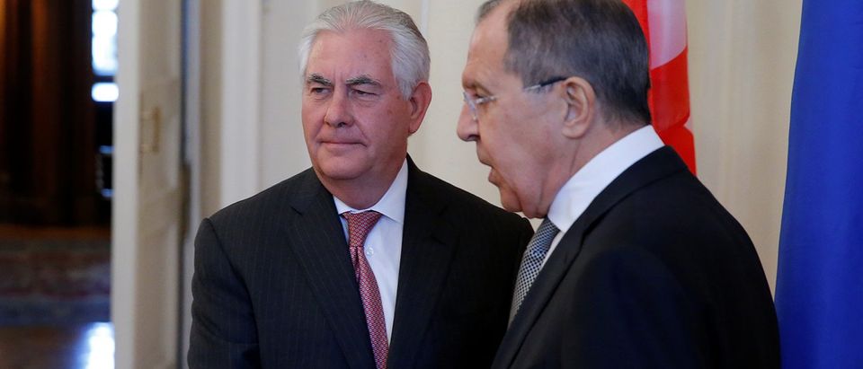 Russian Foreign Minister Lavrov shakes hands with U.S. Secretary of State Tillerson during their meeting in Moscow