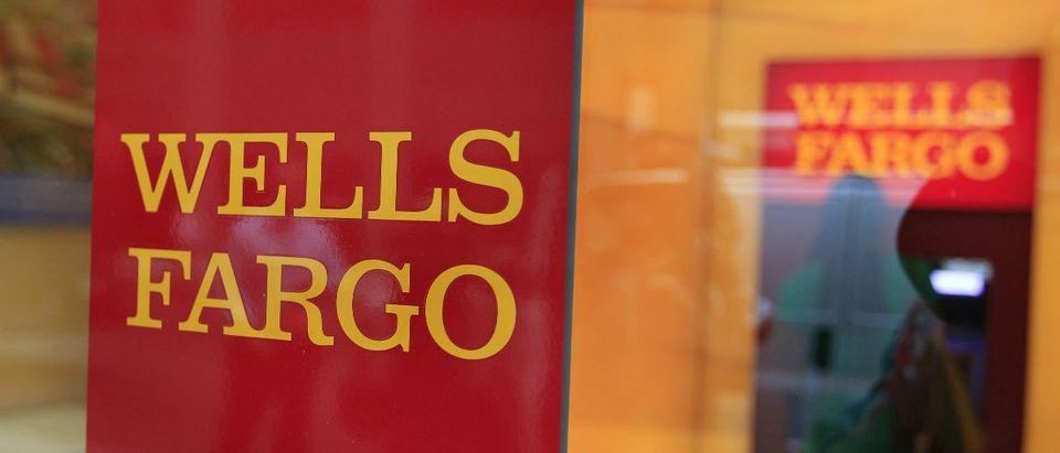 A Wells Fargo sign is seen outside a banking branch in New York (Reuters/Shannon Stapleton)